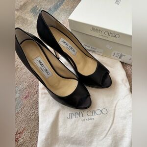 Pre-Loved Kid Leather Black Jimmy Choo shoes for sale! Open toe and stylish!